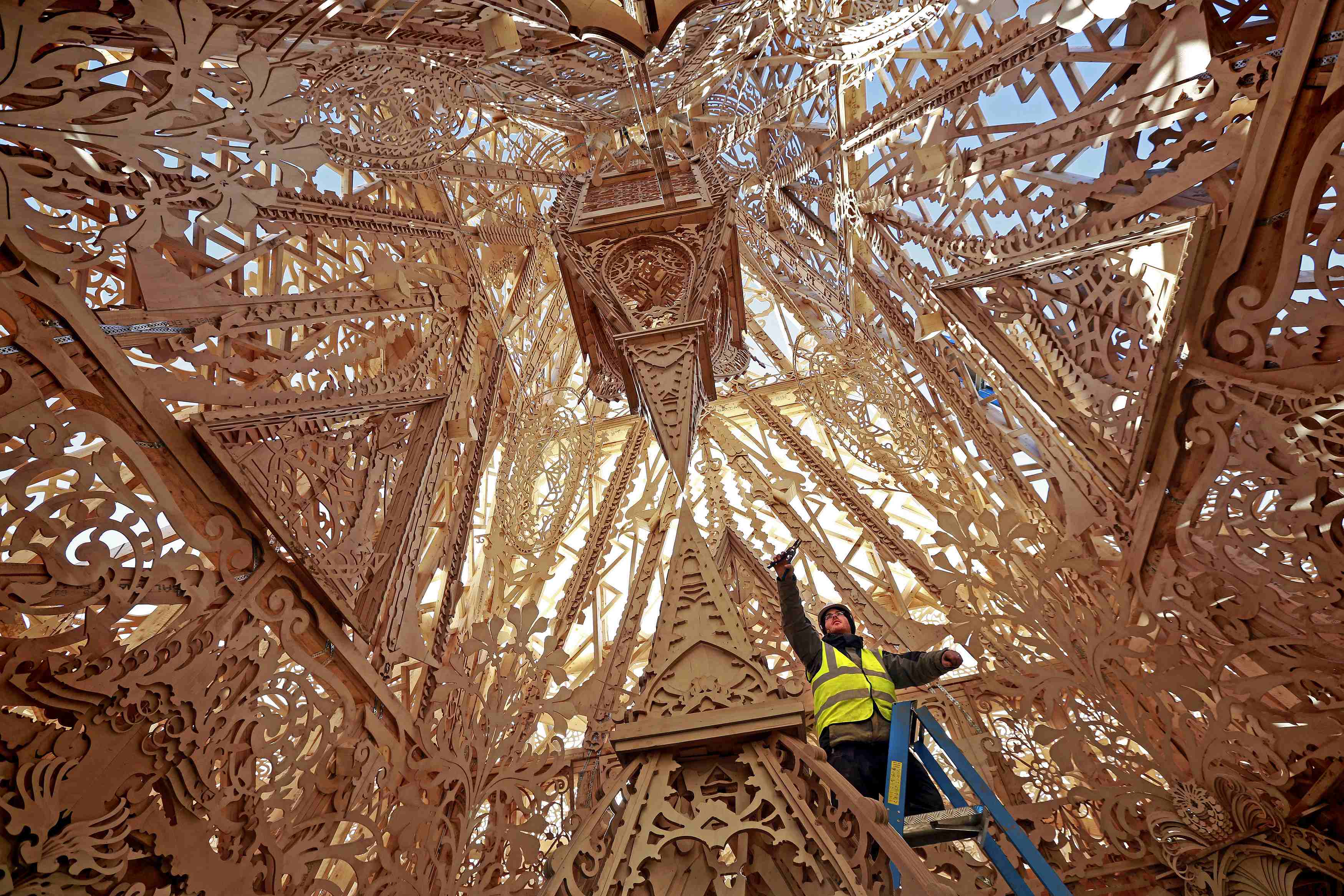 A lighting technician puts the finishing touches to Temple, a cross-community arts project that aims to demonstrate the transformative power of the arts in Londonderry, Northern Ireland