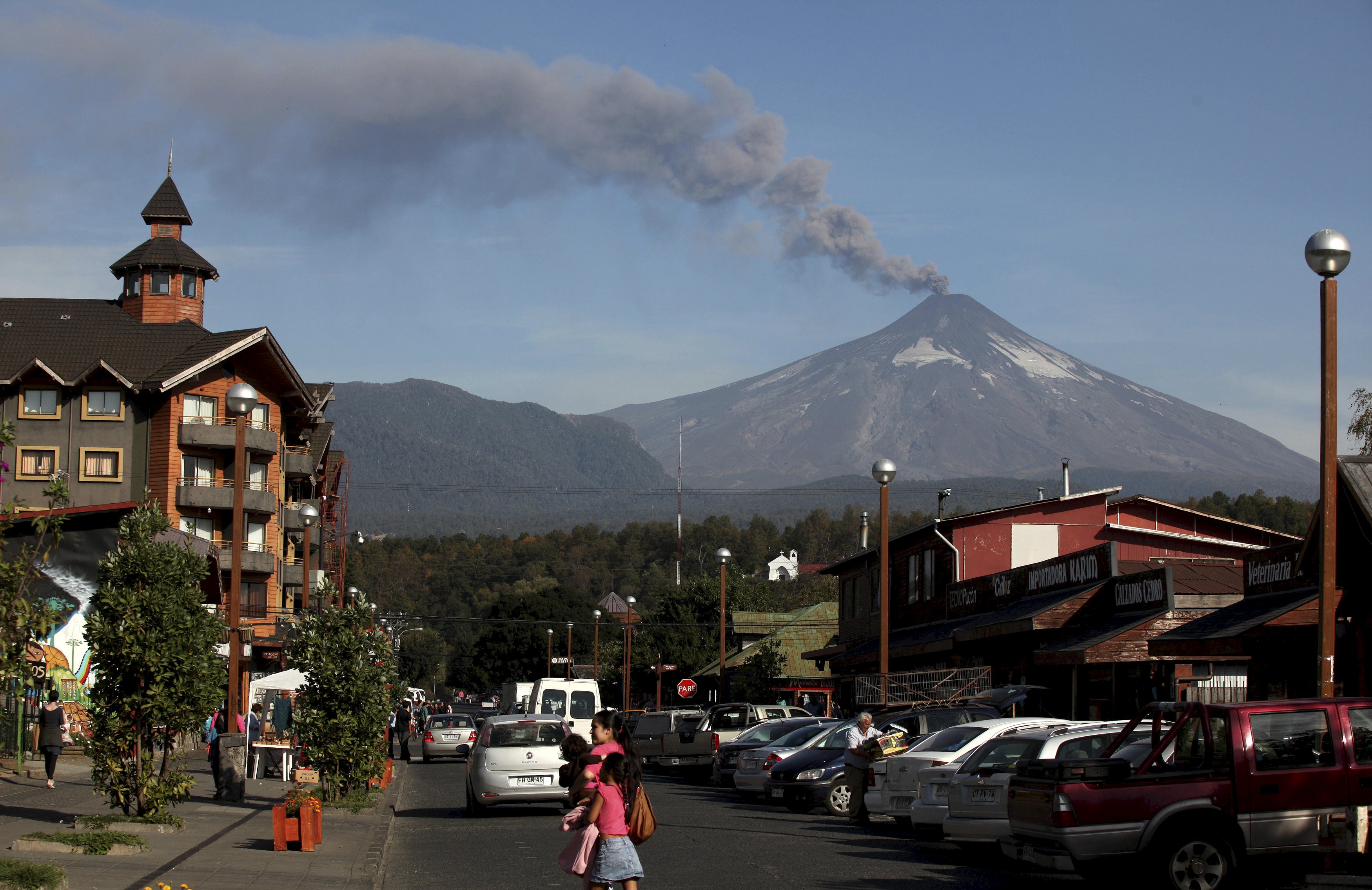 Smoke and lava spew from the Villarrica volcano, as seen from Pucon town, south of Santiago